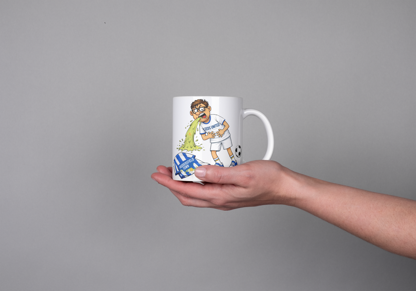 Funny Leeds United Mug – Throwing Up on Huddersfield Shirt
