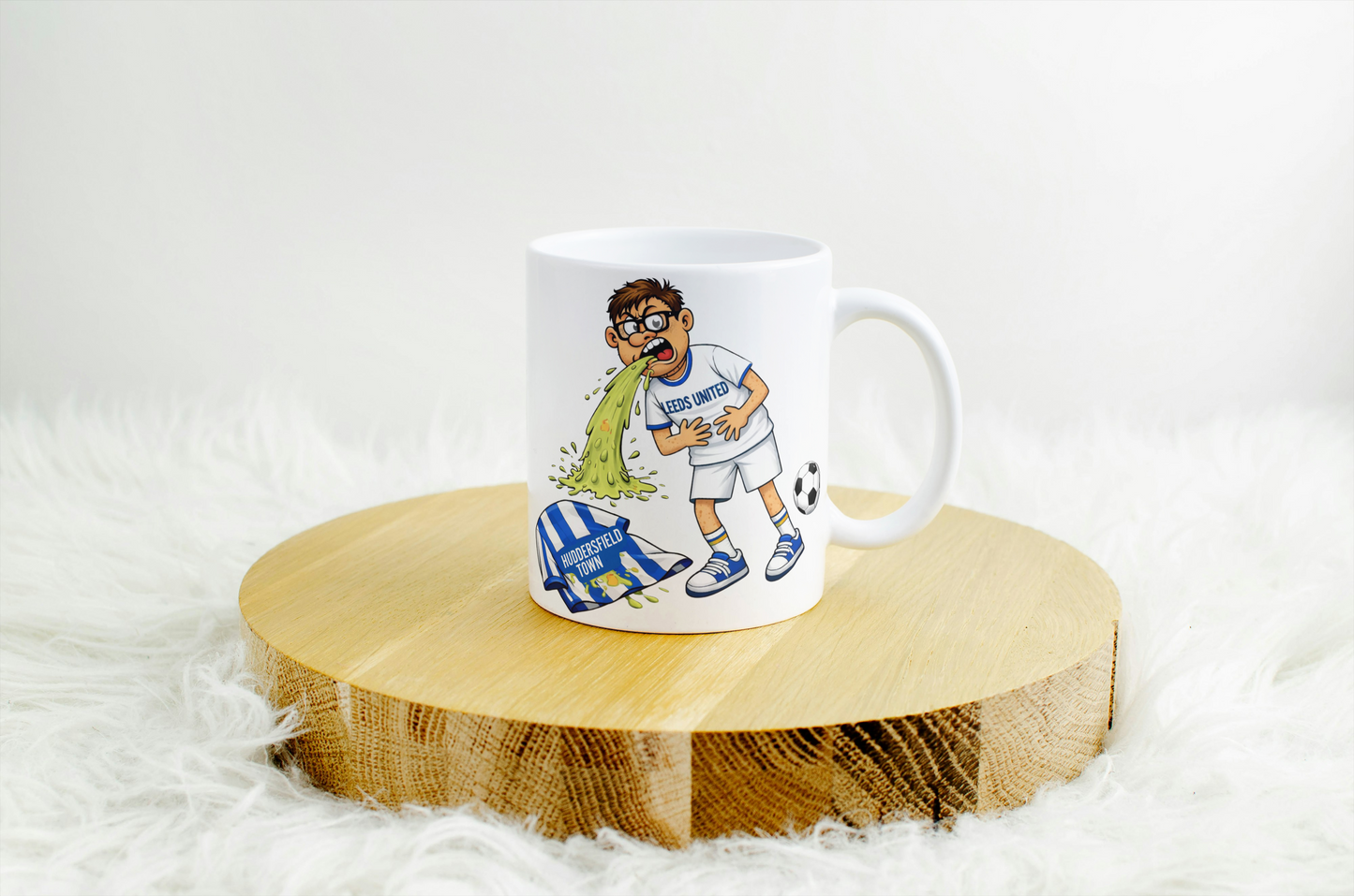 Funny Leeds United Mug – Throwing Up on Huddersfield Shirt